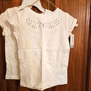 Pair of white decorative tees